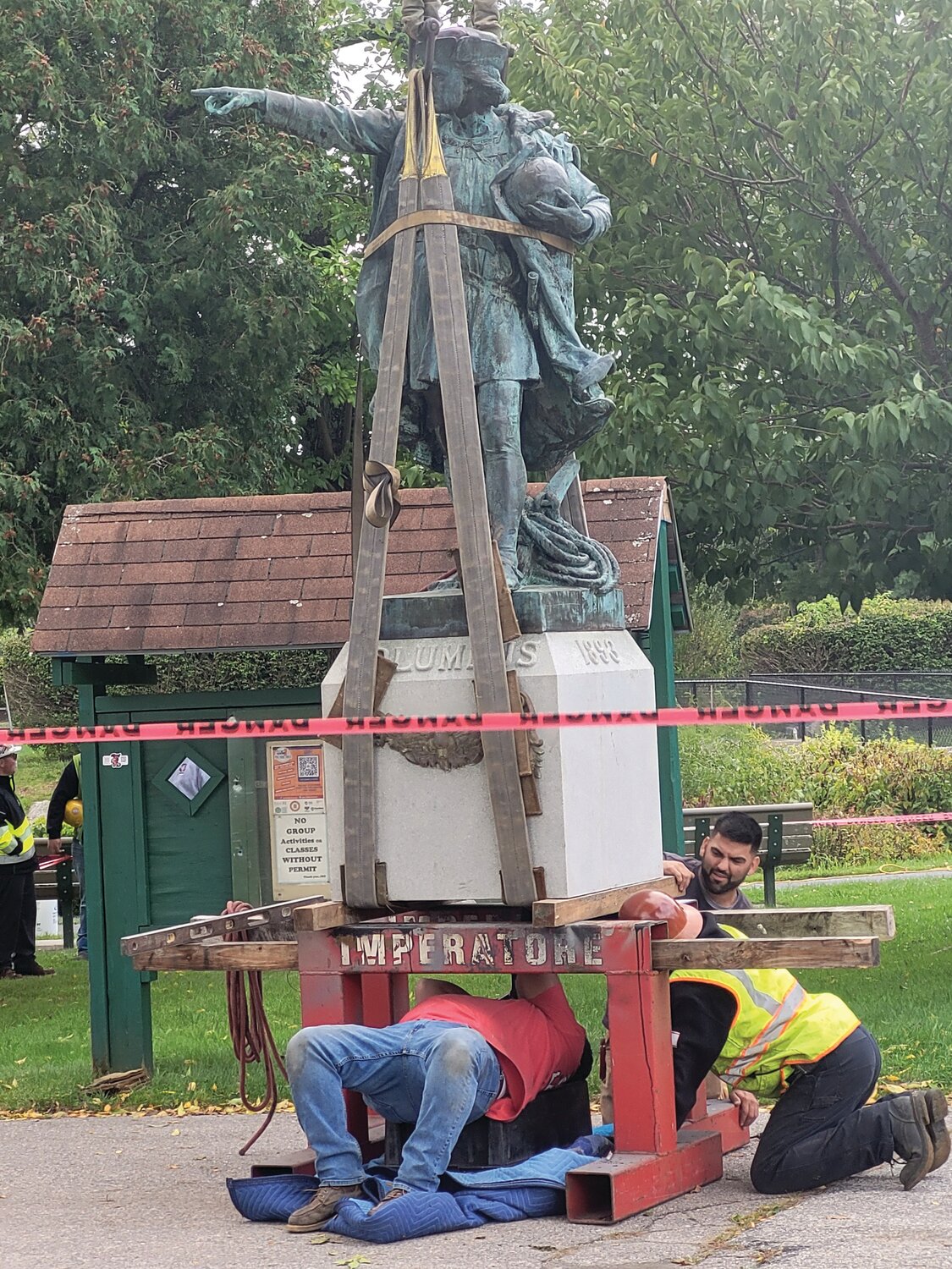 COLUMBUS BY CRANE: The Christopher Columbus statue that stood in Providence for 130 years has been erected on a cement pedestal on the island in the center of Johnston’s War Memorial Park pond. The mayor has planned a Columbus Day unveiling event.